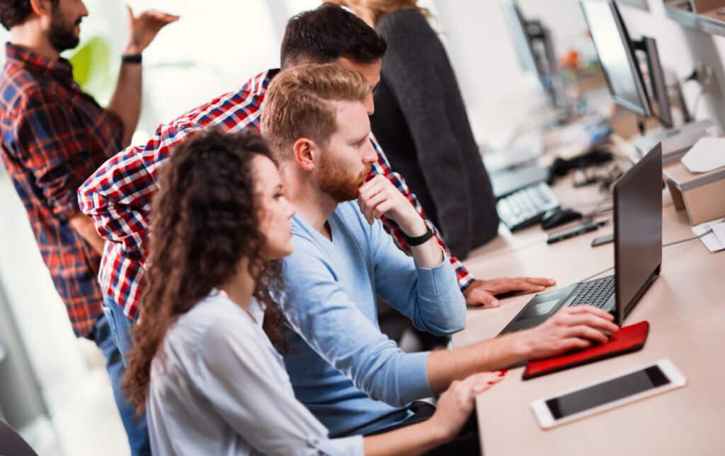 Colleagues working together in company office