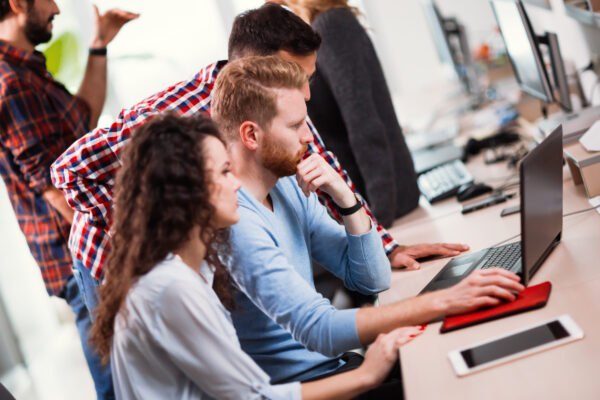 Colleagues working together in company office