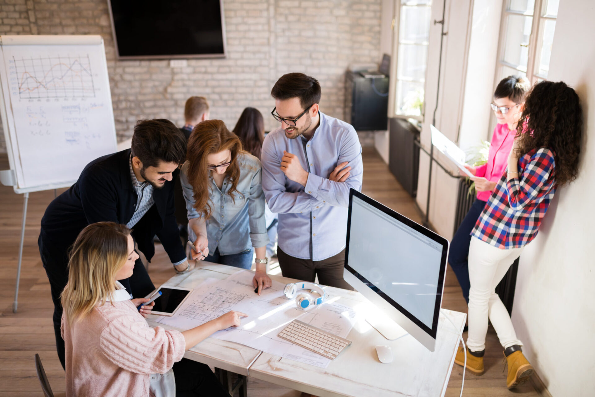 Picture of young architects discussing in office