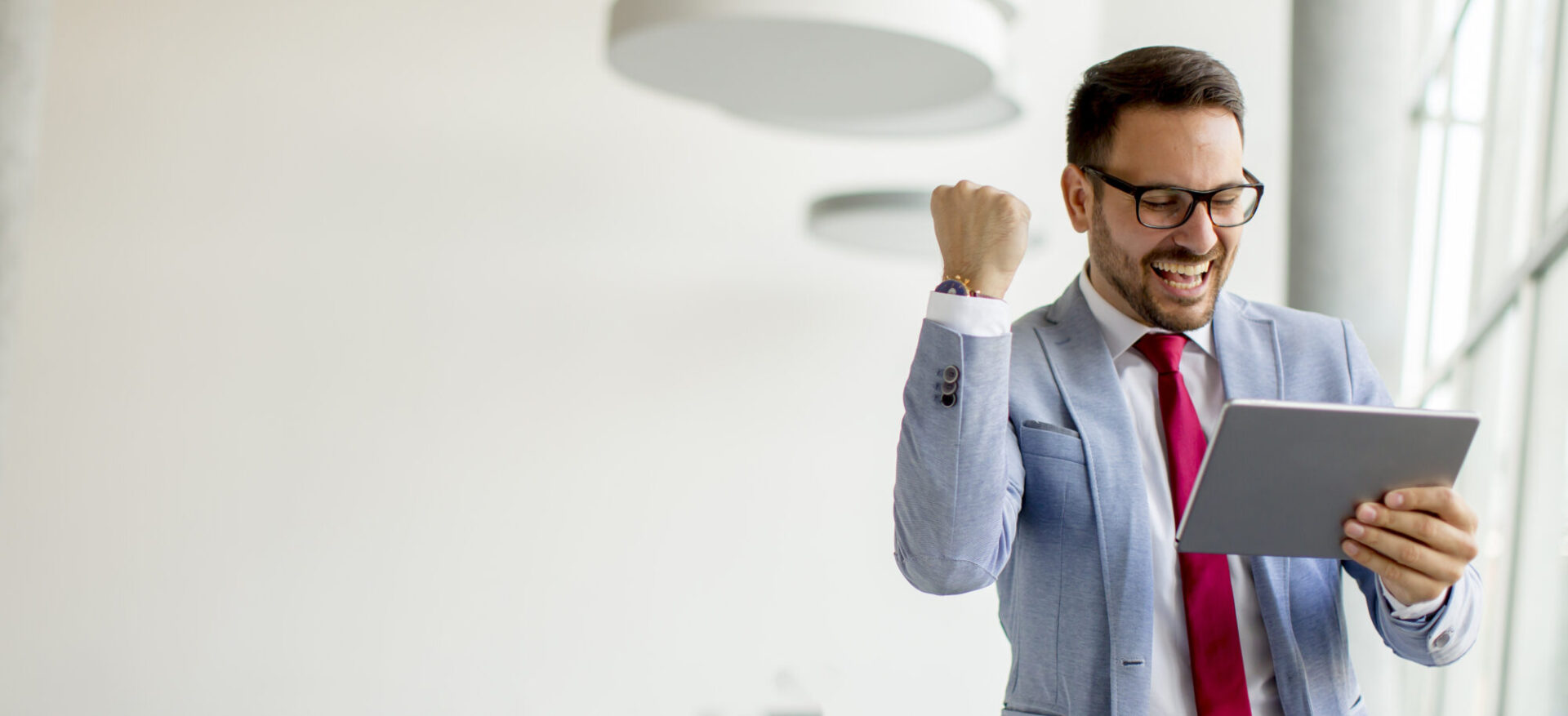 Young businessman with digital tablet in office