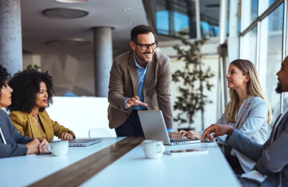 Contemporary office scene with employees and digital data visuals